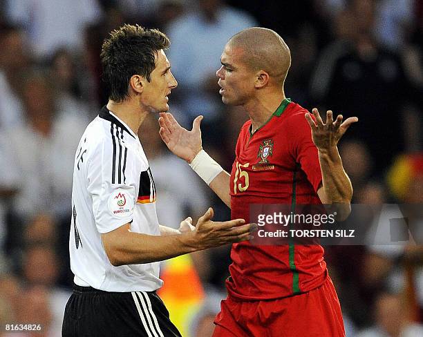 Germany's striker Miroslav Klose and Portuguese defender Pepe argue during the Euro 2008 Championships quarter-final football match between Portugal...