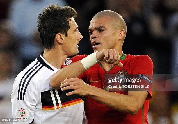 Germany's striker Miroslav Klose and Portuguese defender Pepe argue during the Euro 2008 Championships quarter-final football match between Portugal...