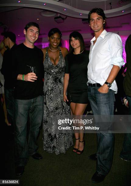 Serena Williams with guests poses inside the Sony Ericsson WTA Tour pre-Wimbledon Player Party at Kensington Roof Gardens June 19, 2008 in London,...