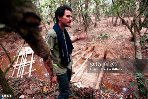 Josias Ramirez supervises the work February 19, 2001 as a chain gang camp is constructed outside the village of El Venado, Colombia. The camp will...
