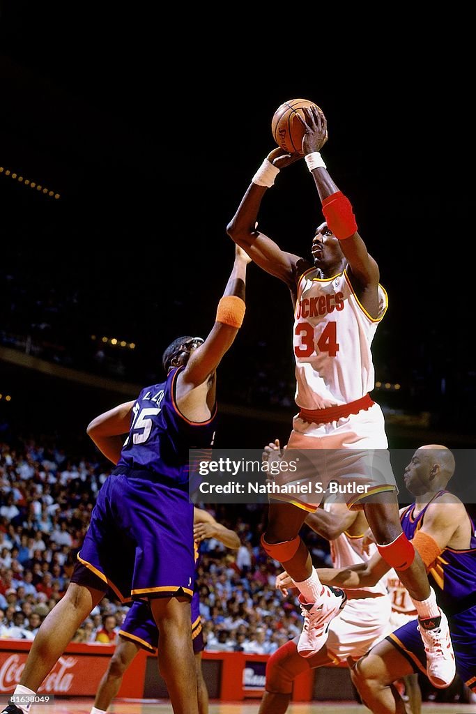 Houston Rockets Match Hakeem Olajuwon of the Houston Rockets goes for a shot against Oliver ...