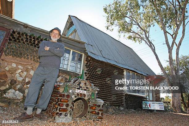 Arthur Germaine waits for visitors outside his 'Bottle House' in the outback opal mining town of Lightning Ridge on June 16, 2008. Arthur spent 40...