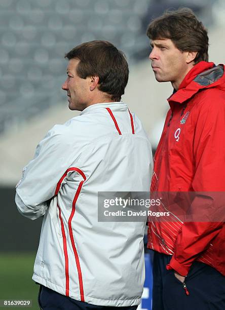 Elite Rugby Director and England tour manager Rob Andrew and RFU legal advisor Richard Smith QC look on during an England training session at AMI...