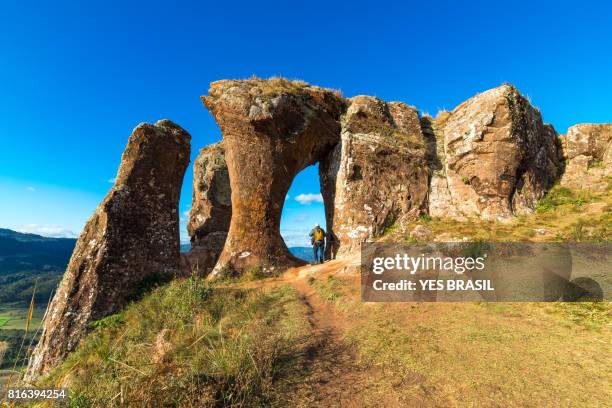 photographer portraying the sunset at morro do campestre, southern brazil - hill range stock pictures, royalty-free photos & images