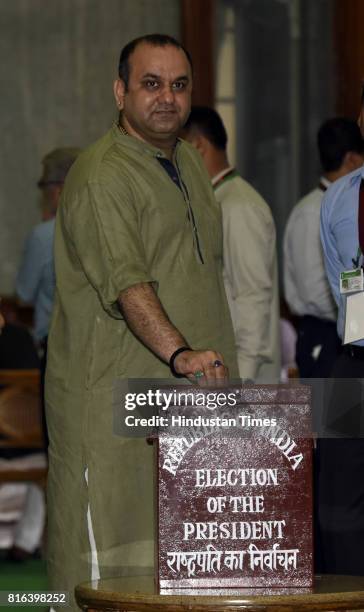 East Delhi MP Maheish Girri casts his vote during the presidential election at the Parliament House on July 17, 2017 in New Delhi, India. Approx. 99%...