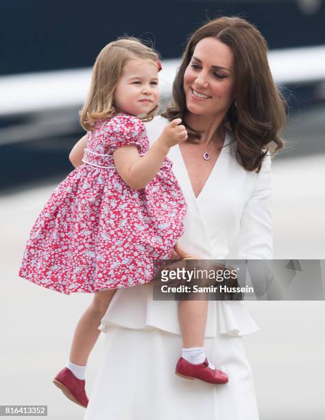 Catherine, Duchess of Cambridge and Princess Charlotte of Cambridge arrive at Warsaw airport during an official visit to Poland and Germany on July...