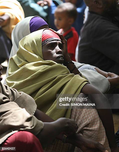 Somali refugee girl has her photo taken for during a verification exercise on June 18, 2008 at the Ifo camp in Daadab, 488 km north east of Nairobi....