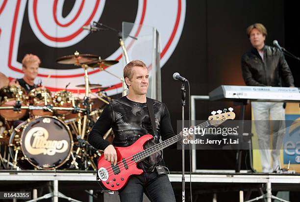 Drummer Tris Lmboden, bassist Jason Scheff, and keyboard player Bill Champlin perform on CBS' "The Early Show" at Charter One Pavilion on June 20,...