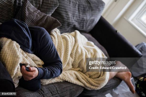 homeless living on a sofa - homelessness stock pictures, royalty-free photos & images