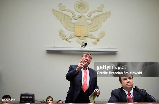 Former White House Press Secretary Scott McClellan listens as his lawyer Michael Tigar tries to object to an opening statement by the committee's...