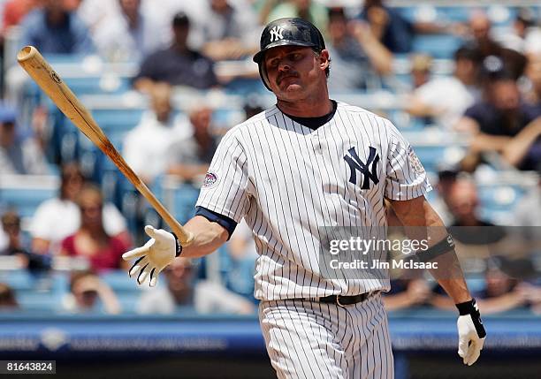 Jason Giambi of the New York Yankees throws his bat after striking out against the San Diego Padres on June 19, 2008 at Yankee Stadium in the Bronx...