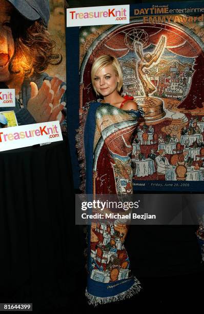 Actress Kirsten Storms poses with products by Treasureknit.com in the Daytime Emmy official gift lounge produced by On 3 Productions held at the...