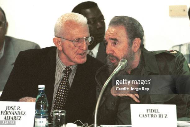 Cuban Vice President Jose Ramon Fernandez, left, speaks with President Fidel Castro March 22, 2001 during a meeting entitled "Giron, 40 Years Later,"...