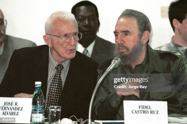 Cuban Vice President Jose Ramon Fernandez, left, speaks with President Fidel Castro March 22, 2001 during a meeting entitled "Giron, 40 Years Later,"...