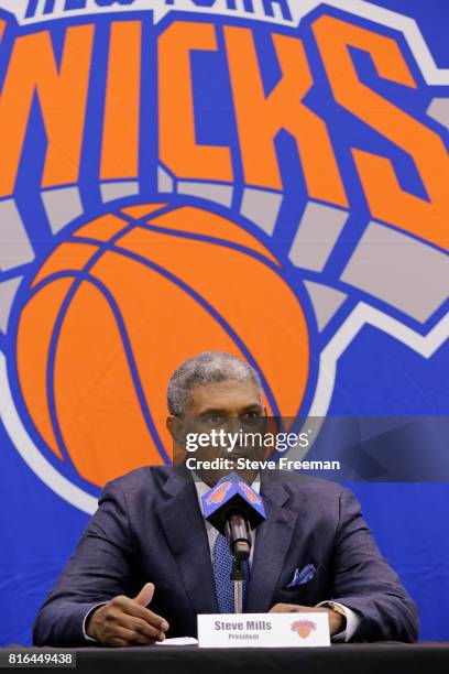 New York Knicks team President, Steve Mills and Jeff Hornacek of the New York Knicks introduce General Manager Scott Perry at a pess conference at...