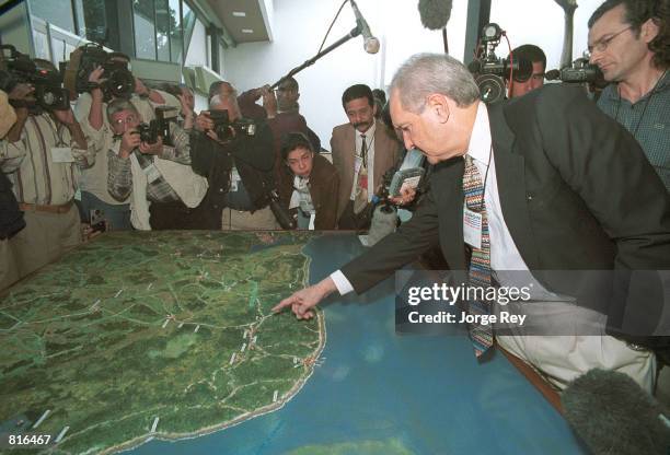 Alfredo Duran explains to journalists March 22, 2001 the operation that he carried out during the invasion of Cube by U.S. Backed Cuban exiles at the...