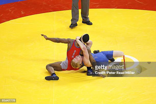 Olympic Team Trials: T.C. Dantzler in action, withstanding choke hold by Cheney Haight during Greco-Roman 74kg class championship match at Thomas &...