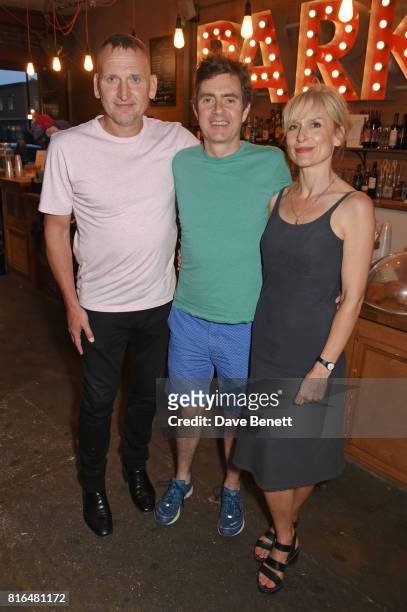 Christopher Eccleston, cast member Paul Higgins and wife Amelia Bullmore attend the press night party for "Twilight Song" at The Park Theatre on July...