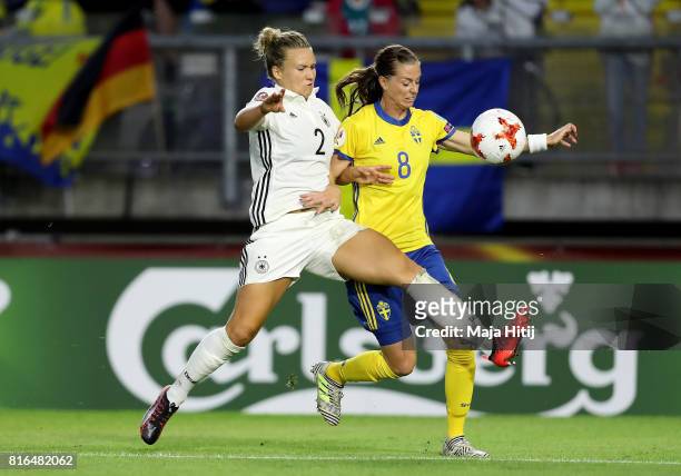 Josephine Henning of Germany and Lotta Schelin of Sweden compete for the ball during the Group B match between Germany and Sweden during the UEFA...