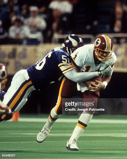 Linebacker Chris Doleman of the Minnesota Vikings sacks quarterback Mark Rypien of the Washington Redskins in the 1992 NFC Wildcard Game at the...