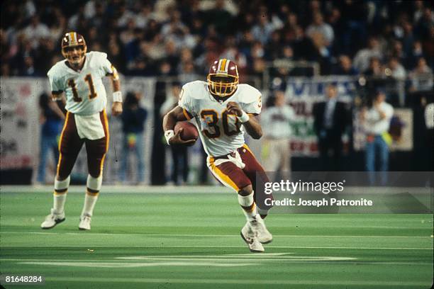 Running back Brian Mitchell of the Washington Redskins runs upfield against the Minnesota Vikings in the 1992 NFC Wildcard Game at the Metrodome on...