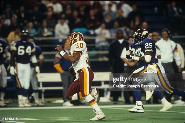 Running back Brian Mitchell of the Washington Redskins runs upfield on a 36-yard fake punt against the Minnesota Vikings in the 1992 NFC Wildcard...