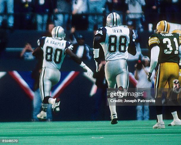 Wide receiver Alvin Harper of the Dallas Cowboys heads to the endzone on a 45-yard touchdown reception against the Green Bay Packers in the 1994 NFC...