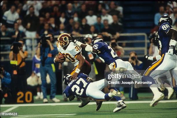 Running back Brian Mitchell of the Washington Redskins runs upfield on a 36-yard fake punt against the Minnesota Vikings in the 1992 NFC Wildcard...