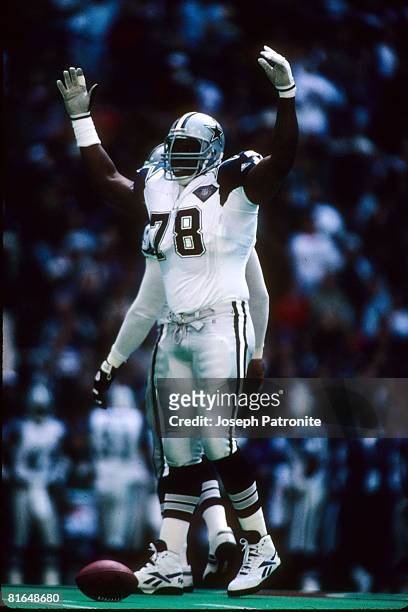 Defensive tackle Leon Lett of the Dallas Cowboys celebrates against the Green Bay Packers in the 1994 NFC Divisional Playoff Game at Texas Stadium on...