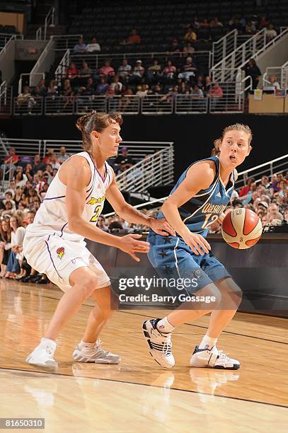 Laurie Koehn of the Washington Mystics moves the ball against Kelly Miller of the Phoenix Mercury during the game on June 3 at U.S. Airways Center in...