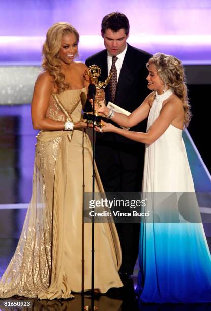 Host Tyra Banks accepts the Outstanding Talk Show / Informative award from presenters Daniel Cosgove and Marcy Rylan during the 35th Annual Daytime...
