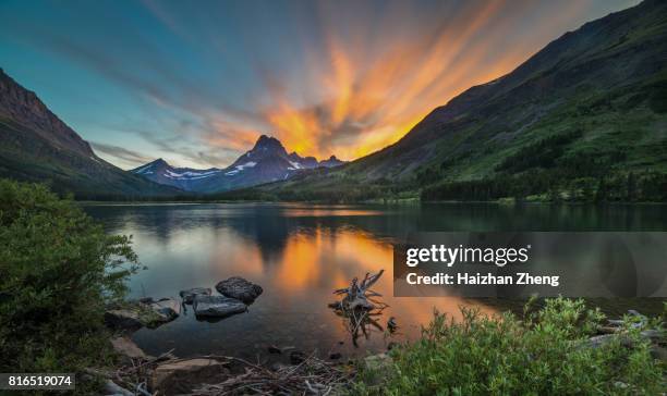 swiftcurrent lake at dawn - montana stock pictures, royalty-free photos & images