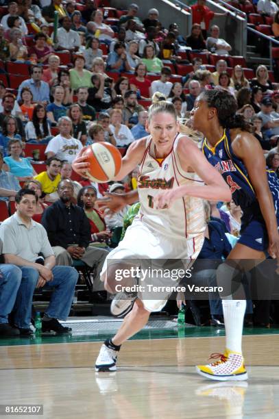 Lauren Jackson of the Seattle Storm drives past the defense of Tamika Catchings of the Indiana Fever on June 20, 2008 at the Key Arena in Seattle,...