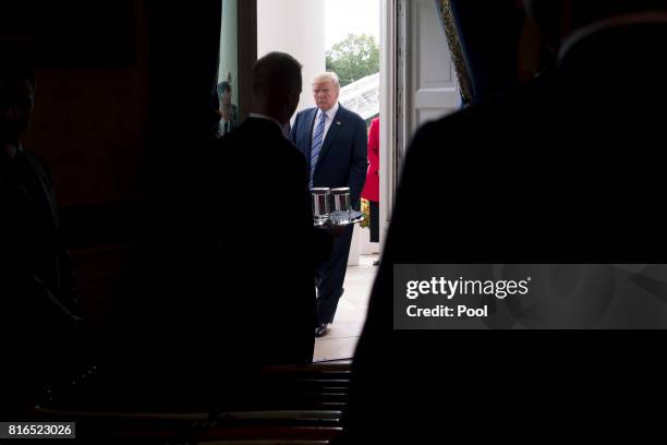 President Donald Trump walks into the Blue Room of the White House while participating in a Made in America event with companies from 50 states...