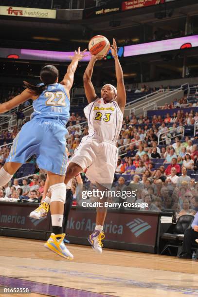 Cappie Pondexter of the Phoenix Mercury shoots against Armintie Price of the Chicago Sky on June 20 at U.S. Airways Center in Phoenix, Arizona. NOTE...