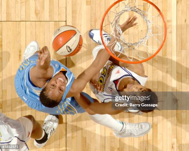 Chasity Melvin of the Chicago Sky shoots against Tangela Smith of the Phoenix Mercury on June 20 at U.S. Airways Center in Phoenix, Arizona. NOTE TO...