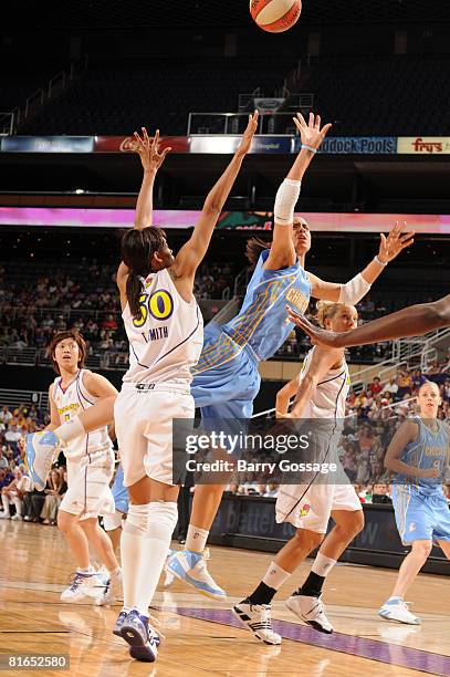 Candice Dupree of the Chicago Sky shoots against Tangela Smith of the Phoenix Mercury on June 20 at U.S. Airways Center in Phoenix, Arizona. NOTE TO...