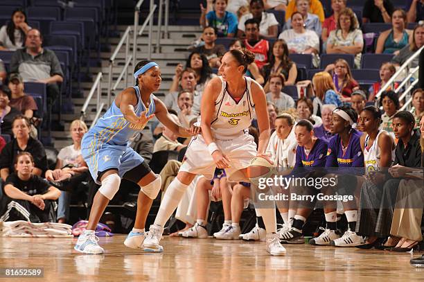 Diana Taurasi of the Phoenix Mercury handles the ball against Dominique Canty of the Chicago Sky on June 20 at U.S. Airways Center in Phoenix,...