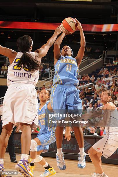 Jia Perkins of the Chicago Sky shoots against Cappie Pondexter of the Phoenix Mercury on June 20 at U.S. Airways Center in Phoenix, Arizona. NOTE TO...