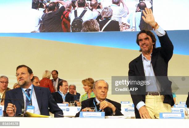 The leader of the Spanish conservative opposition Popular Party , Mariano Rajoy , former Galicia PP leader Manuel Fraga Iribarne sit as former PP...