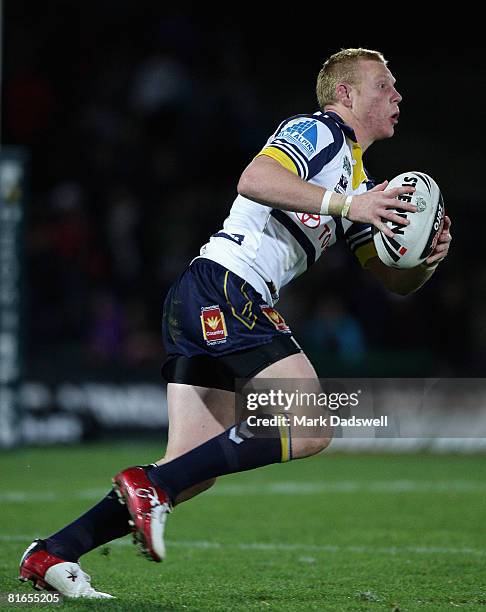 Anthony Watts of the Cowboys runs the ball up during the round 15 NRL match between the Melbourne Storm and the North Queensland Cowboys at Olympic...