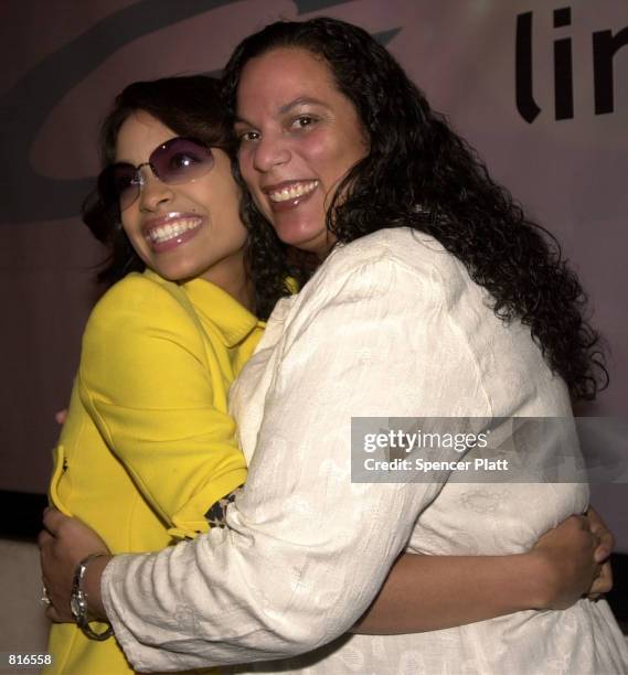 Rosario Dawson, left, poses with her mother Isabell March 22, 2001 at a launch party for Sama Line 3 sunglasses in New York.