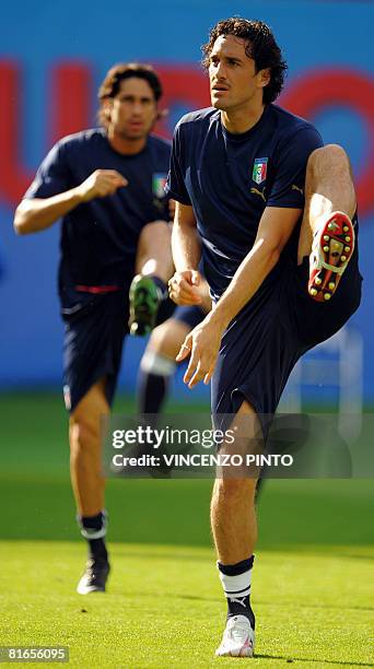 Italian forward Luca Toni practices next to teammate Marco Borriello during a training session in Vienna on June 21, 2008. Italy will play their Euro...