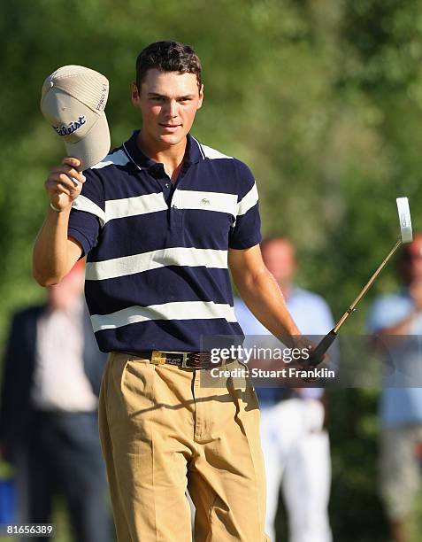 Martin Kaymer of Germany celebrates his birdie putt on the 18th hole during the third round of The BMW International Open Golf at The Munich North...