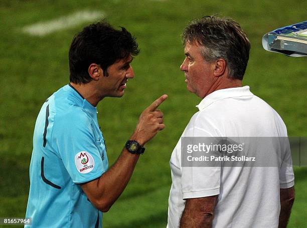 Guus Hiddink, head coach of Russia speaks to an official on the sidelines during the UEFA EURO 2008 Quarter Final match between Netherlands and...