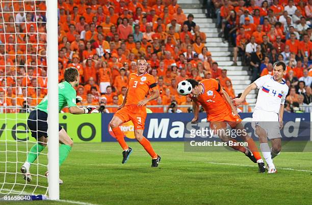 Ruud van Nistelrooy of Netherlands headers and scores his teams first goal of the game during the UEFA EURO 2008 Quarter Final match between...