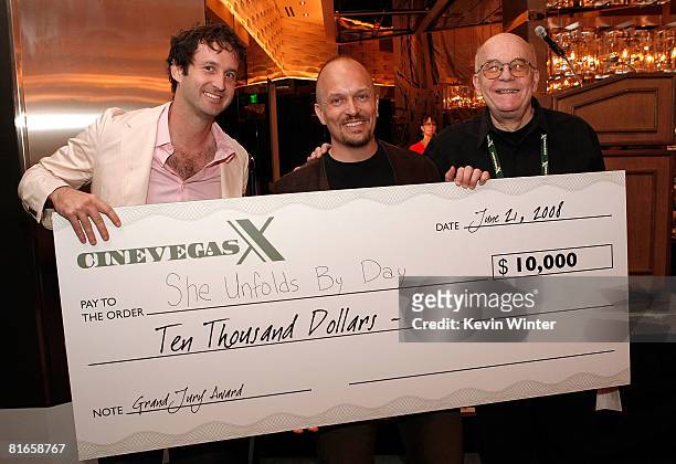 CineVegas artistic director Trevor Groth and juror Bob Hawk present the Grand Jury award to filmmaker Rolf Belgum of "She Unfolds The Day" at the...
