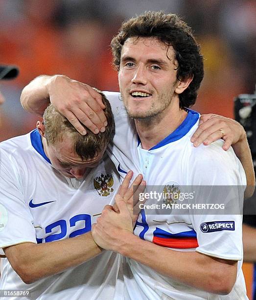 Russian defender Alexander Anyukov and midfielder teammate Yuri Zhirkov celebrate after they won the Euro 2008 Championships quarter-final football...