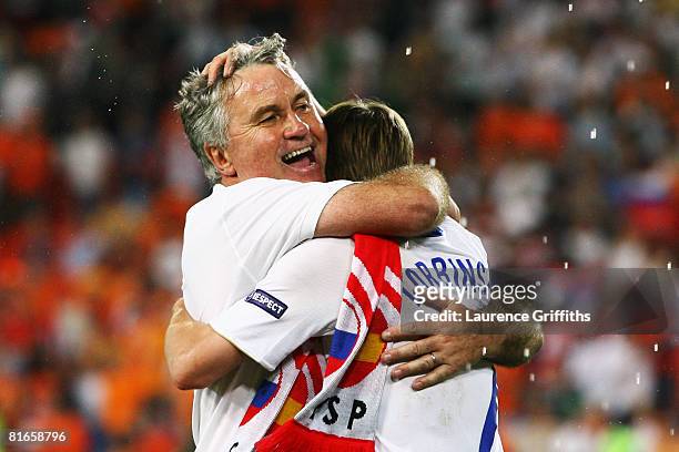 Guus Hiddink, head coach of Russia celebrates victory with Dmitri Torbinskiy of Russia after the UEFA EURO 2008 Quarter Final match between...