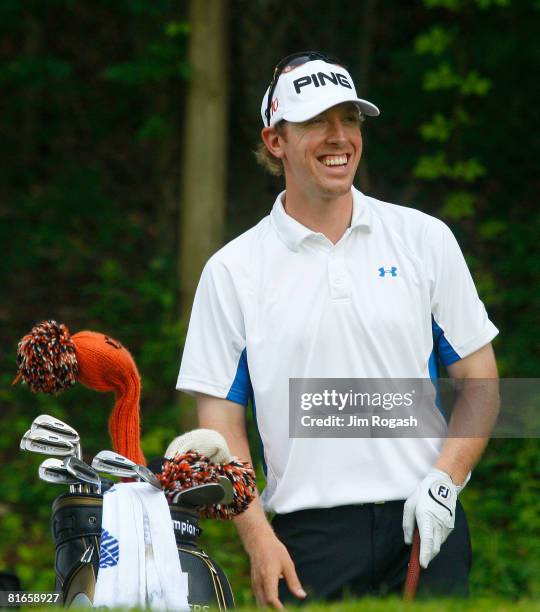 Hunter Mahan enjoys a laugh on the 15th tee box during the third round of the Travelers Championship at TPC River Highlands held on June 21, 2008 in...